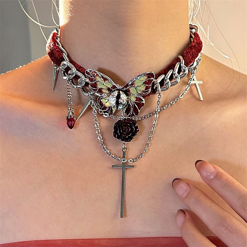 Gothic red velvet butterfly choker necklace with red velvet ribbon and silver butterfly pendant on a model's neck 4