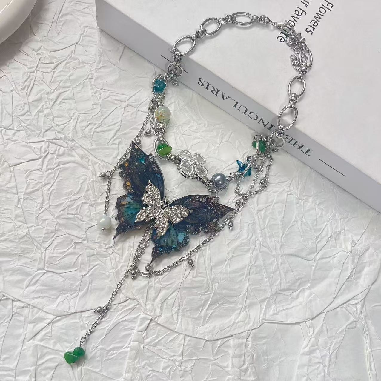 Y2K retro irregular beaded tassel butterfly choker on a model 2