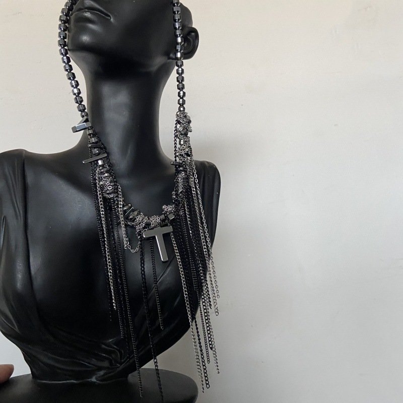 Dark punk choker with cross tassel and irregular beads on display 2