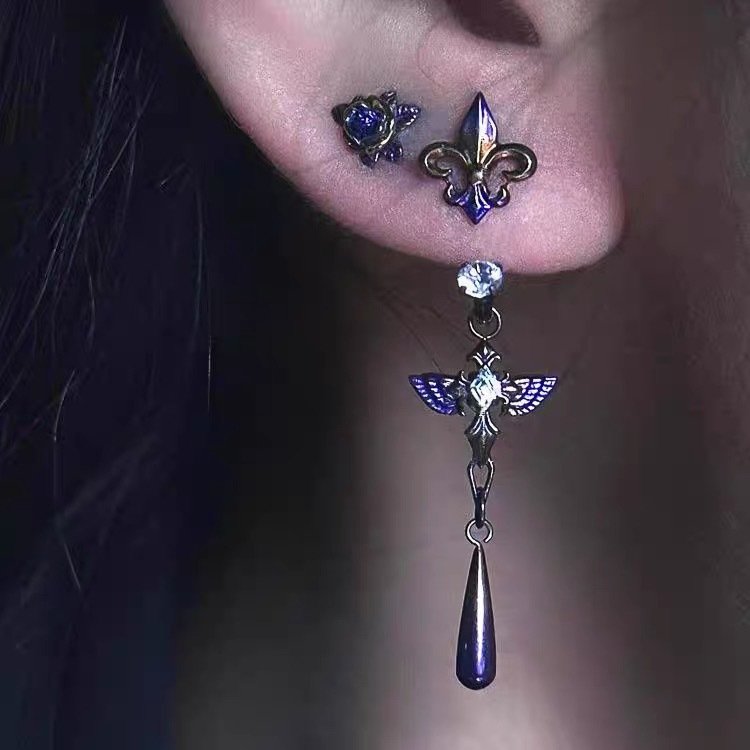 Purple iris pendant earrings on a model showing minimalist design 2