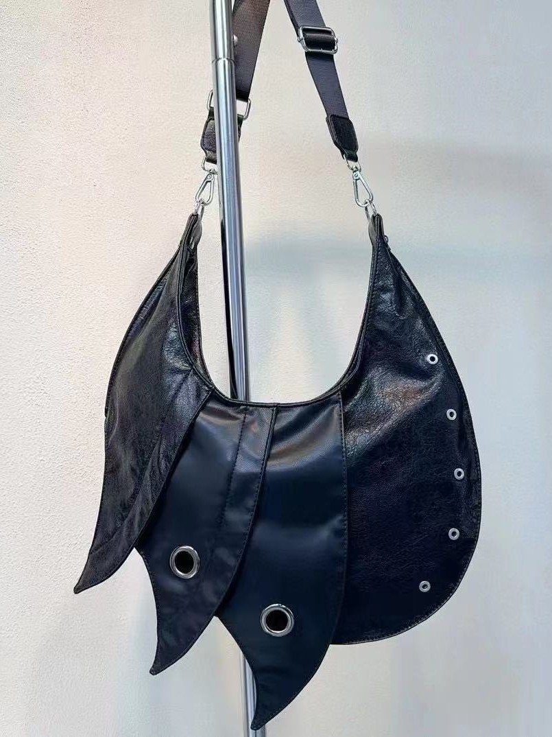 Darkvibe Punk Armor Bag with metallic accents, worn as a crossbody bag 2