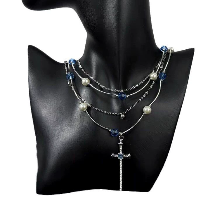 Gothic choker with layered blue pearls and cross pendant