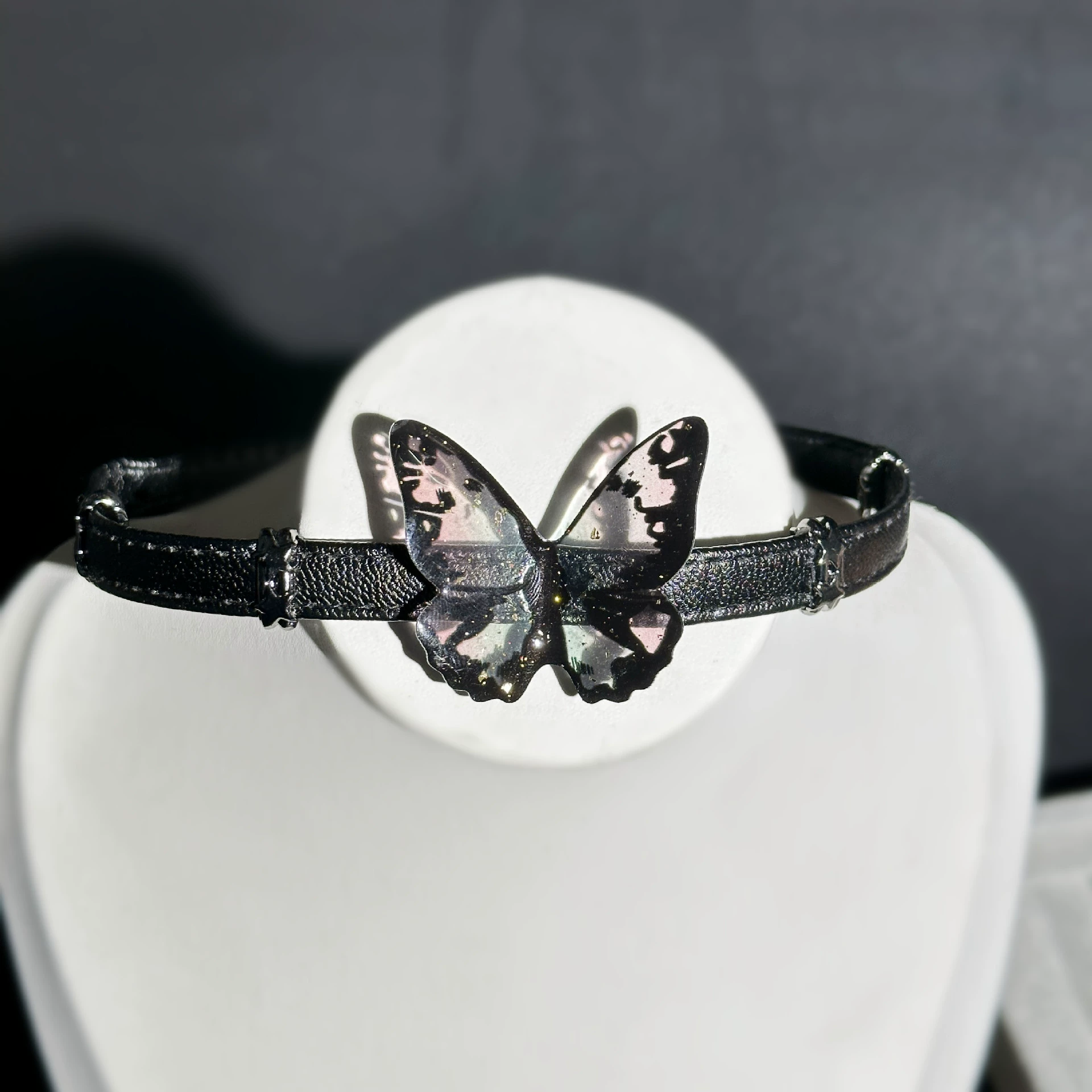 Butterfly tassel leather choker on model, showcasing cool summer style